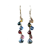 Transformation multigemstone Dancing Amulets earrings. Six gemstone teardrops in colors of yellow citrine, green tourmaline, blue kyanite, red garnet, pink tourmaline, and silver labradorite hang from a gold chain
