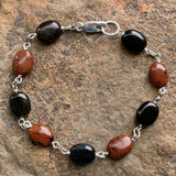 mahogany obsidian and hawks eye 